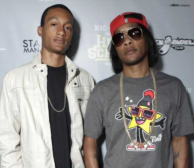 David Blake Jr. and David Blake aka DJ Quik pose for a photograph