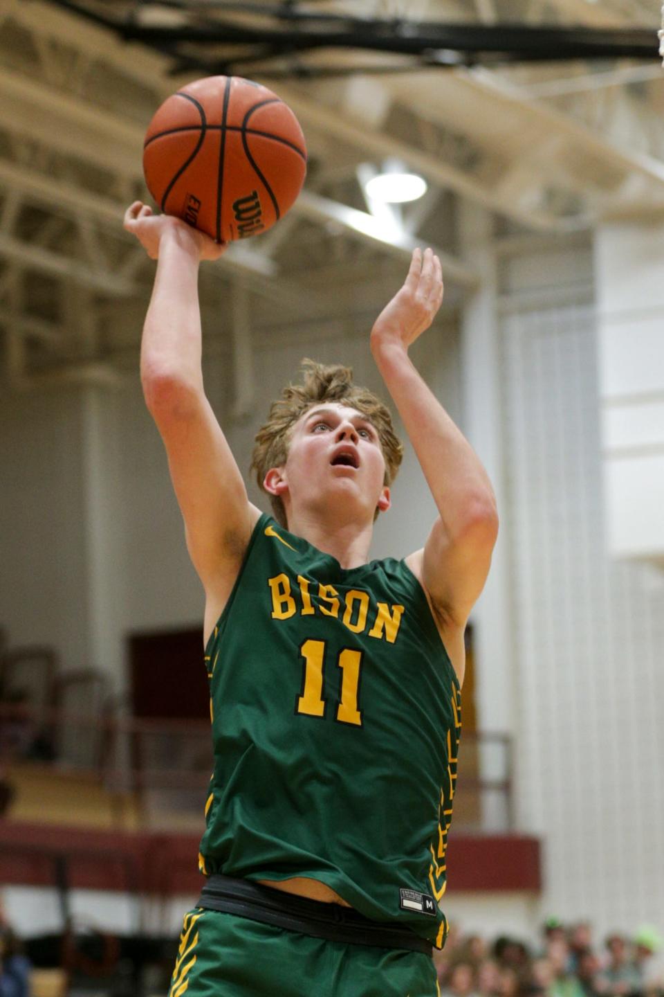 Benton Central's Dawson Brock (11) goes up for a layup during the third quarter of an IHSAA boys basketball game, Tuesday, Feb. 22, 2022 in Lafayette.