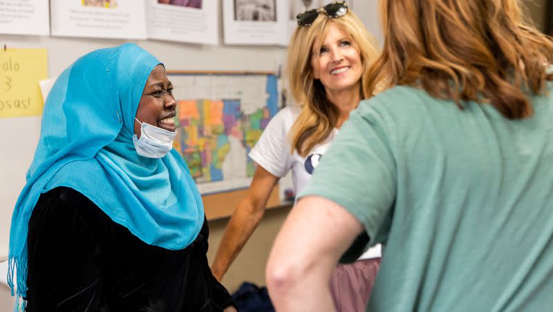 Zinab, left, from Sudan, talks to Suzanne Headden, Sharehouse manager, and Amy Dott Harmer, right, executive director for the Utah Refugee Connection, at the Serve Refugees Sharehouse in South Salt Lake on Thursday, July 13, 2023.