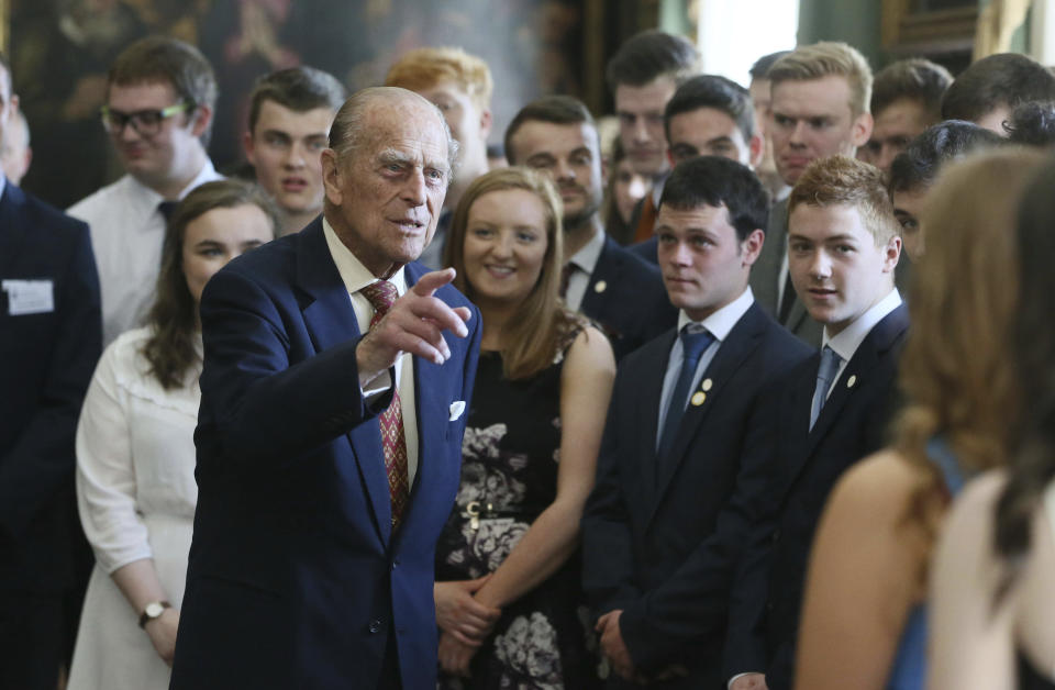 FILE - In this May 25, 2017 file photo, Britain's Prince Philip, the Duke of Edinburgh, hosts the Duke of Edinburgh's Award gold award presentations at Hillsborough Castle, Belfast, northern Ireland. Prince Philip, the irascible and tough-minded husband of Queen Elizabeth II who spent more than seven decades supporting his wife in a role that both defined and constricted his life, has died, Buckingham Palace said Friday, April 9, 2021. He was 99. (Brian Lawless/PA via AP, File)