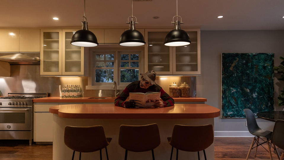 Krueger reading up on some recipes in the kitchen - Credit: Anthony Barcelo