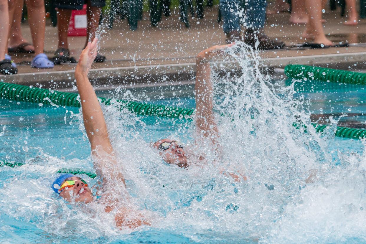 Kade Opsal and Hadyn Gould compete in the 50-meter backstroke at the OMSSL championships at Greenhills, Ohio.