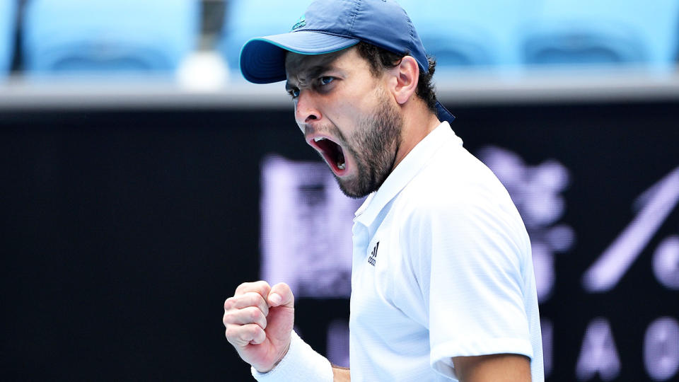 Russia's Aslan Karatsev pulled off a five-set upset against Felix Auger-Aliassime to qualify for the Australian Open quarter-finals. (Photo by PAUL CROCK/AFP via Getty Images)