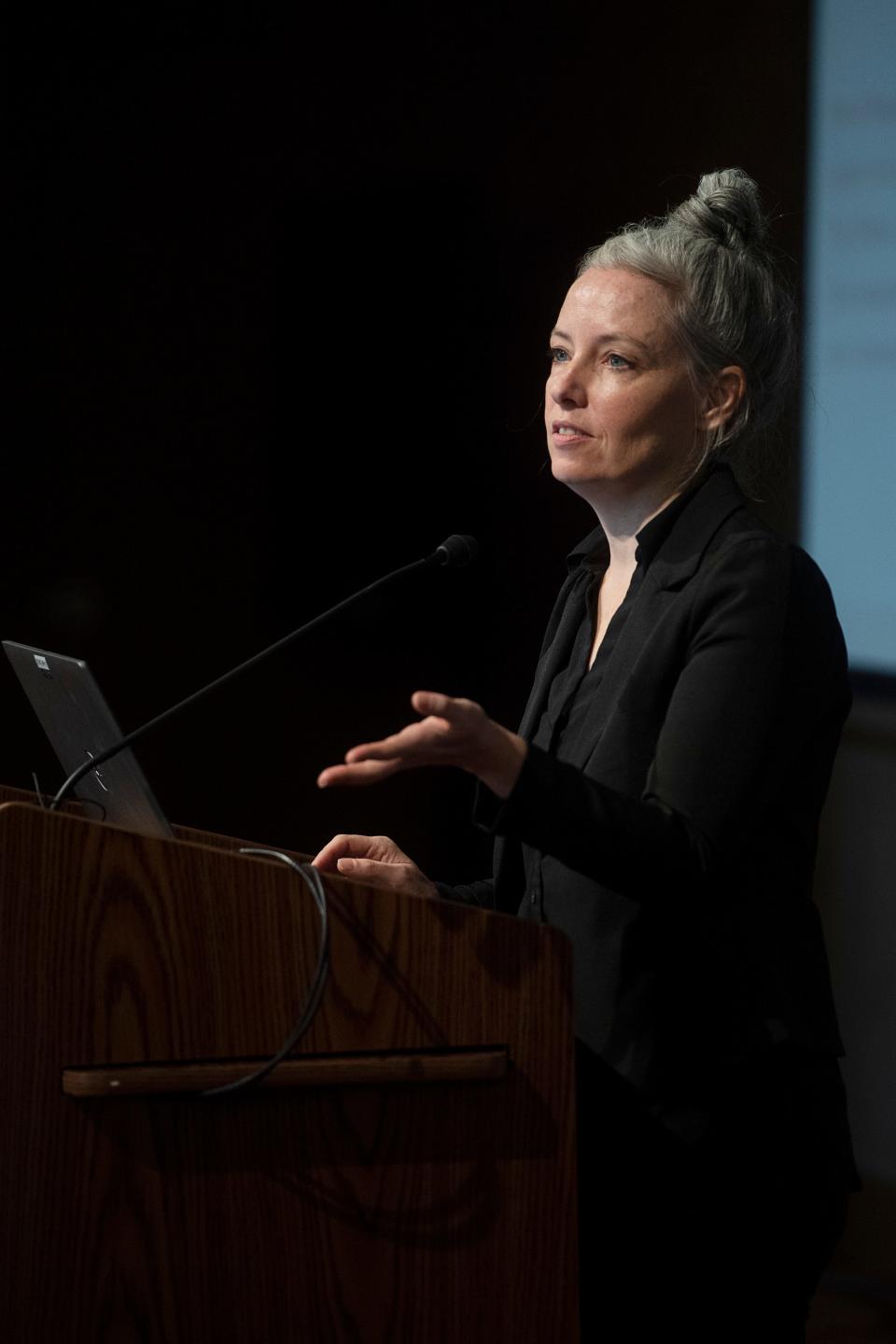 Homeless Strategy Division Manager Emily Ball speaks to Asheville City Council and the Buncombe County Board of Commissioners during a meeting at Harrah’s Cherokee Center, December 4, 2023.