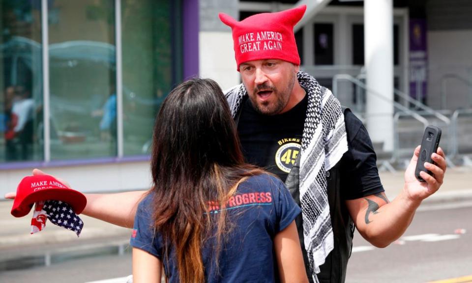 A Trump supporter faces off with a protester near the Amway Center