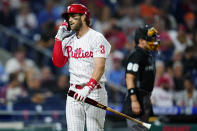 Philadelphia Phillies' Bryce Harper reacts after striking out against Baltimore Orioles pitcher John Means during the fourth inning of an interleague baseball game, Monday, Sept. 20, 2021, in Philadelphia. (AP Photo/Matt Slocum)