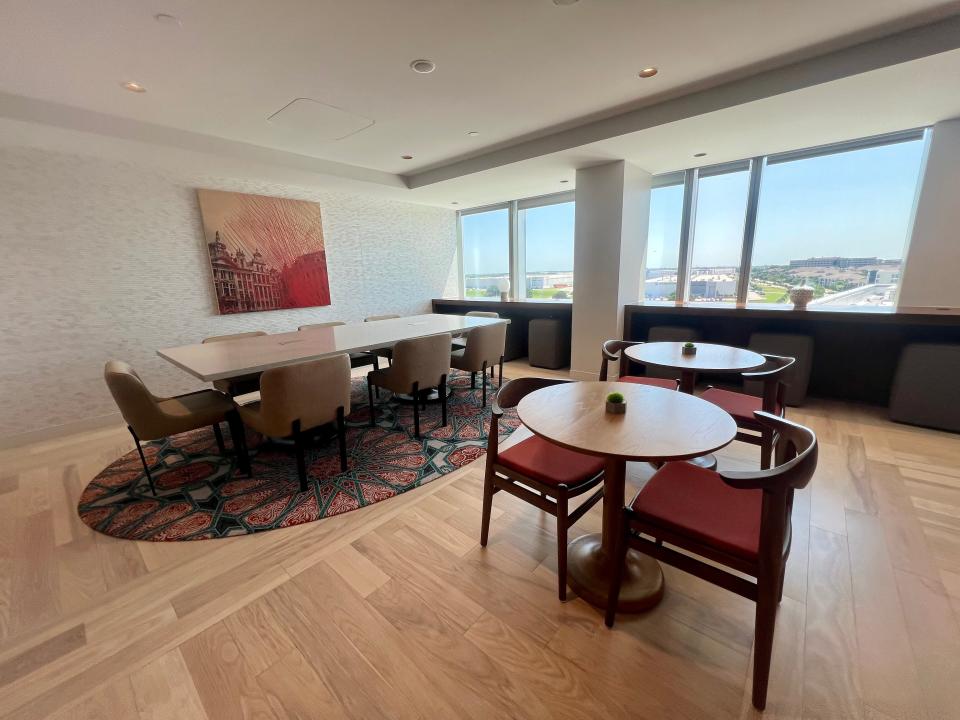 The study area of the lounge on the 8th floor of Skyview 6 with red color scheme and a window.