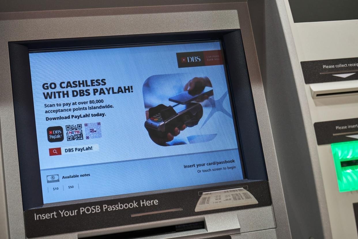 The DBS PayLah personal mobile wallet is advertised on an ATM at a DBS bank branch in Singapore.