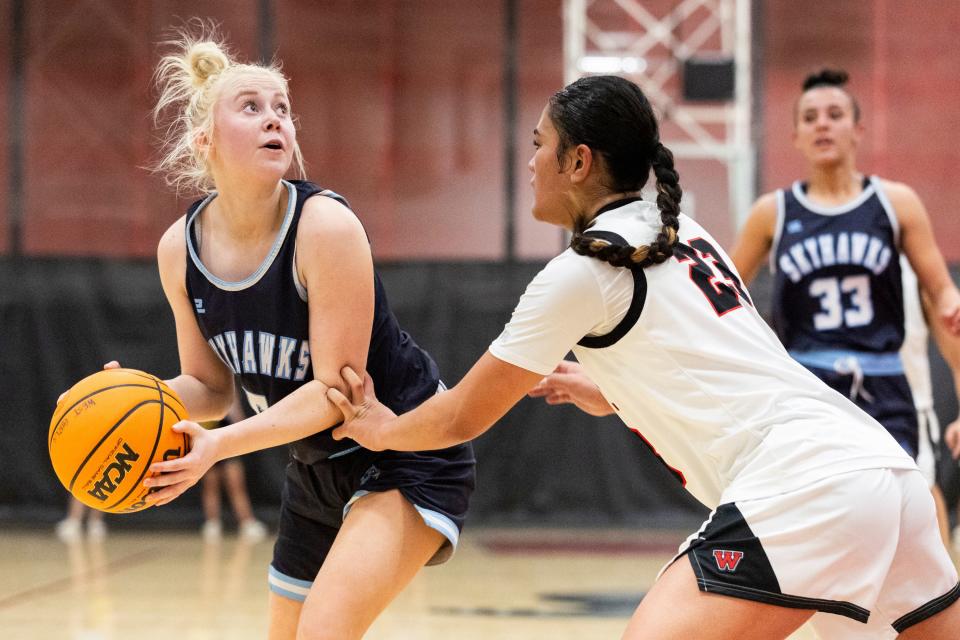 Salem Hills Skyhawks’ Bri Frampton (5) looks to shoot the ball past West Panthers guard/forward Tia Pan (23) during a game at West High School in Salt Lake City on Thursday, Feb. 22, 2024. | Marielle Scott, Deseret News
