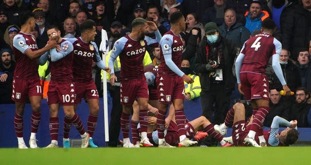 Aston Villa&#x002019;s Lucas Digne and Matty Cash react to being hit by a missile at Goodison Park