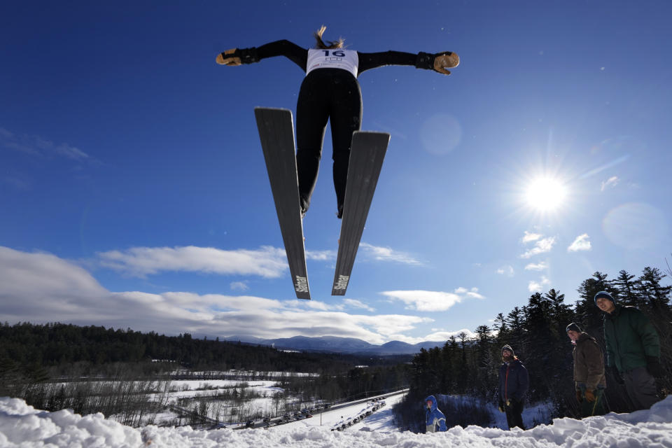 Hailey Garnsey, 16, of Campton, N.H. soars off the 39-meter jump during the Eastern Ski Jumping Meet, Sunday, Jan. 21, 2024, in Milan, N.H. Garnsey is one of a growing number of girls taking part in a once male-dominated sport. (AP Photo/Robert F. Bukaty)