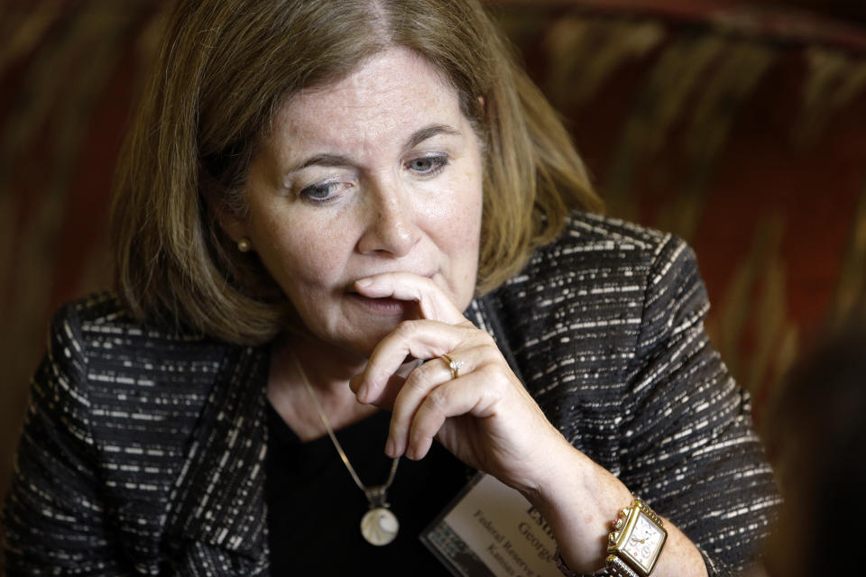 Esther George, president and chief executive officer of the Federal Reserve Bank of Kansas City, speaks with a colleague during the Jackson Hole Economic Policy Symposium at the Jackson Lake Lodge in Grand Teton National Park near Jackson, Wyo., Friday, Aug. 22, 2014. (AP Photo/John Locher)