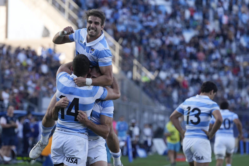 Argentina's Emiliano Boffelli, 14, celebrates with teammates after marking a try against Australia, during their Rugby Championship match at the Bicentenario stadium in San Juan, Argentina, Saturday, Aug. 13, 2022. (AP Photo/Natacha Pisarenko)