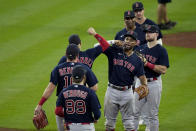 The Boston Red Sox celebrate after their win against the Houston Astros in Game 2 of baseball's American League Championship Series Saturday, Oct. 16, 2021, in Houston. (AP Photo/Sue Ogrocki)