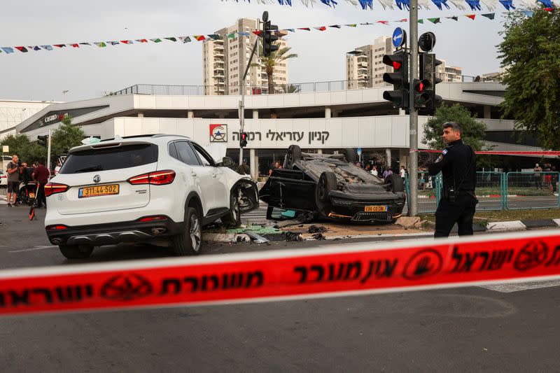 Israeli security forces secure the area where a suspected stabbing incident took place, in Ramle