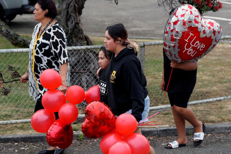 Relatives react as they wait for rescue mission, following the White Island volcano eruption in Whakatane