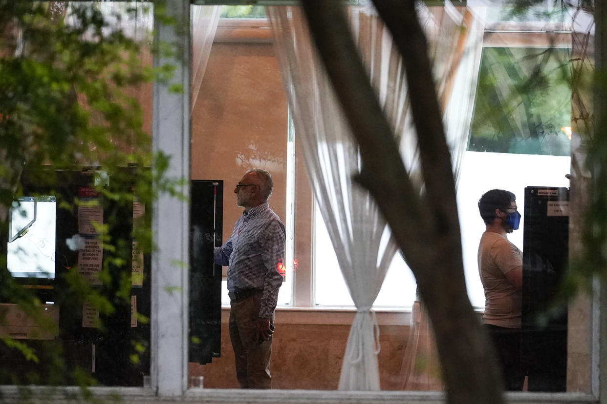 People vote in the Georgia's primary election on Tuesday, May 24, 2022, in Atlanta. (AP Photo/Brynn Anderson)