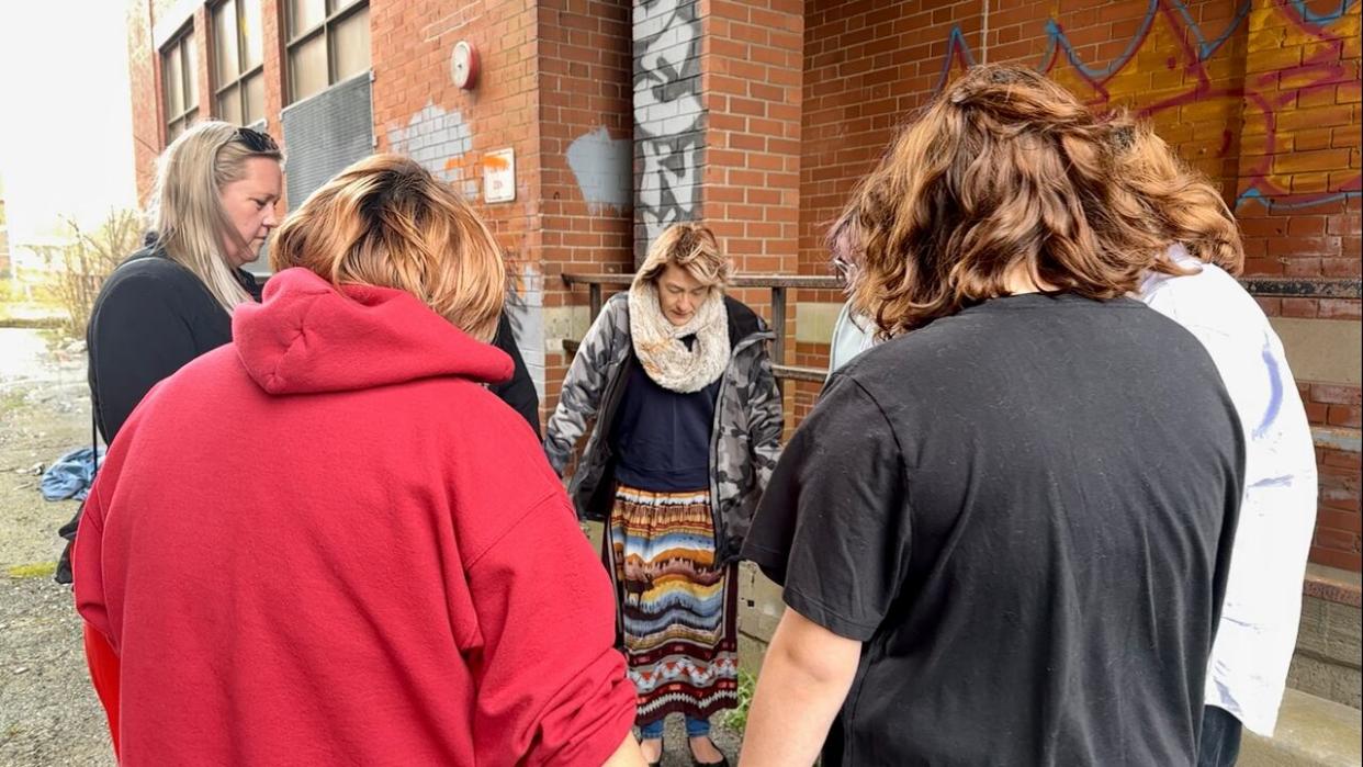 A small group of family and friends gathered on the anniversary of Tanya Brooks's killing at the site where her body was found. (Taryn Grant/CBC - image credit)