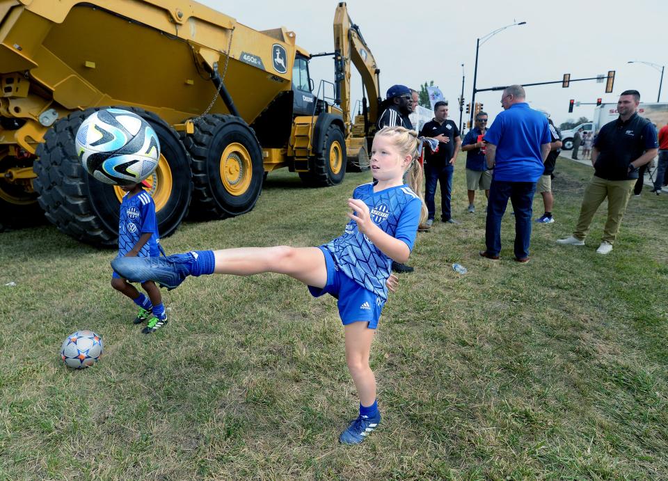 Paisley Leach, 9, of Springfield, who plays in the Springfield Area Soccer Association, juggles a soccer ball after attending the Scheels Sports Park at Legacy Pointe groundbreaking on South MacArthur Blvd., Wednesday, Sept. 20, 2023.