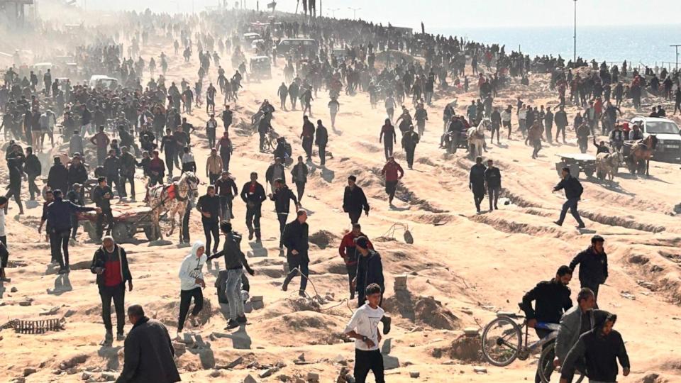 PHOTO: Palestinians wait for humanitarian aid on a beachfront in Gaza City, Gaza Strip, Feb. 25, 2024. (Mahmoud Essa/AP)