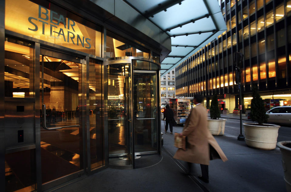 FILE - In this  Monday, March 17, 2008, file photo, an employee enters Bear Stearns in New York. While JP Morgan didn't buy Bear Stearns until 2008, in 2013, it is contesting the attorney general's lawsuit, which targets investments sold by the company in 2006 and 2007.  (AP Photo/Mark Lennihan, File)