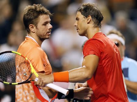 Aug 9, 2018; Toronto, Ontario, Canada; Stan Wawrinka (left) and Rafael Nadal (right) meet at center court following their match in the Rogers Cup tennis tournament at Aviva Centre. John E. Sokolowski-USA TODAY Sports