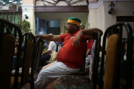 A follower of the Yoruba religion listens to the recommendations based on their annual predictions for the New Year during a news conference in Havana, Cuba, January 3, 2017. REUTERS/Alexandre Meneghini