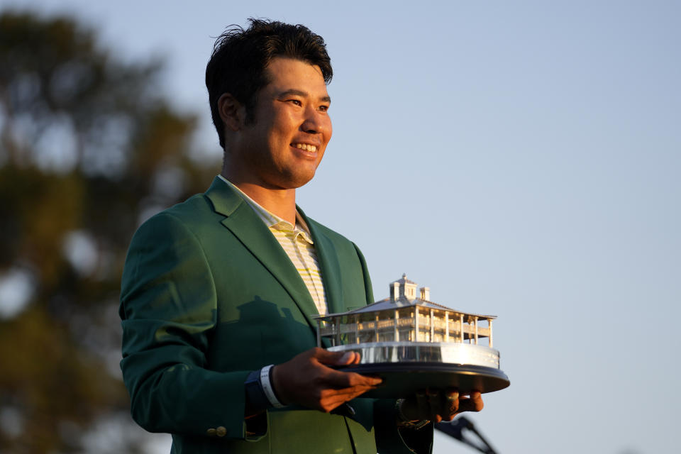 Hideki Matsuyama, of Japan, holds the trophy after winning the Masters golf tournament on Sunday, April 11, 2021, in Augusta, Ga. (AP Photo/Matt Slocum)