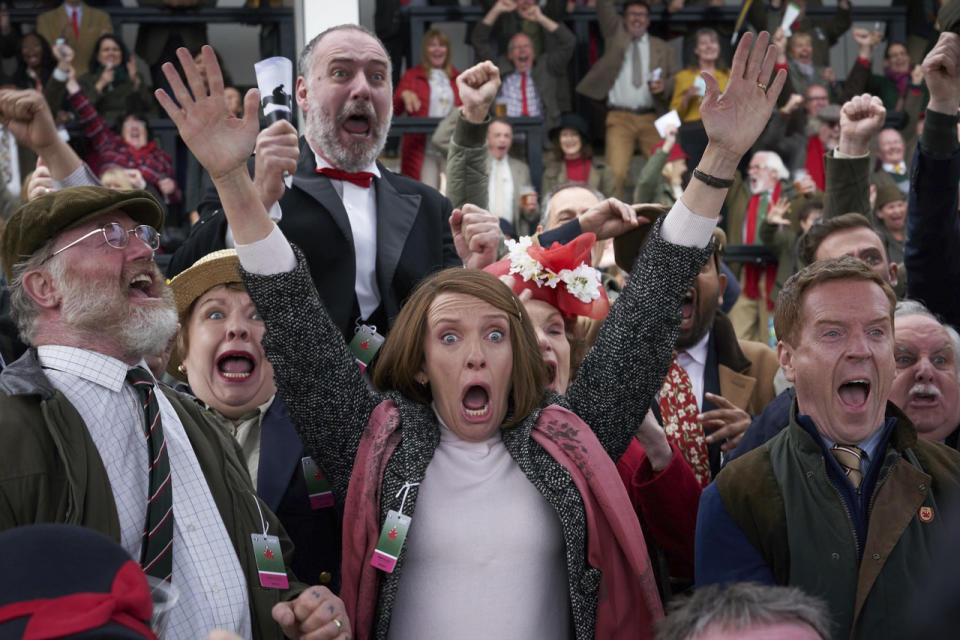 This image released by Bleecker Street shows Owen Teale, foreground from left, Toni Collette and Damian Lewis in a scene from "Dream Horse." (Kerry Brown/Bleecker Street via AP)