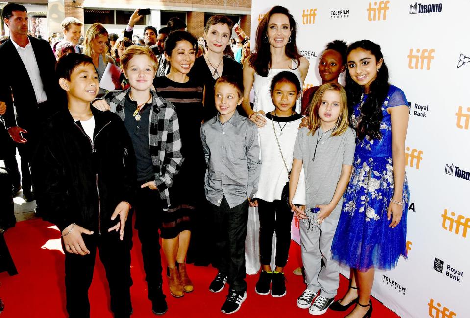 It was <em>almost</em> the same situation in Toronto the night before, when Jolie brought <a href="http://people.com/celebrity/family-fun-angelina-jolie-takes-5-of-her-6-kids-to-the-toronto-film-festival/" rel="nofollow noopener" target="_blank" data-ylk="slk:everyone but Maddox and Pax;elm:context_link;itc:0;sec:content-canvas" class="link ">everyone but Maddox and Pax</a> to the premiere of her other upcoming film, <em>The Breadwinner, </em>which she helped produce. At the festival, she shared, "I did start to get into acting and I did it partially because it was something to do with my mom and it made her so happy ... I haven't done much since she passed away, in front of the camera. Now <a href="https://people.com/movies/angelina-jolie-maleficent-voice/" rel="nofollow noopener" target="_blank" data-ylk="slk:I do it for my kids;elm:context_link;itc:0;sec:content-canvas" class="link ">I do it for my kids</a>. And I do love it! It is fun! Who doesn't love to get silly?"