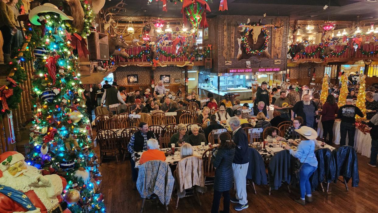 Families packed the Big Texan restaurant on Thanksgiving for its annual holiday meal on Thursday in East Amarillo.