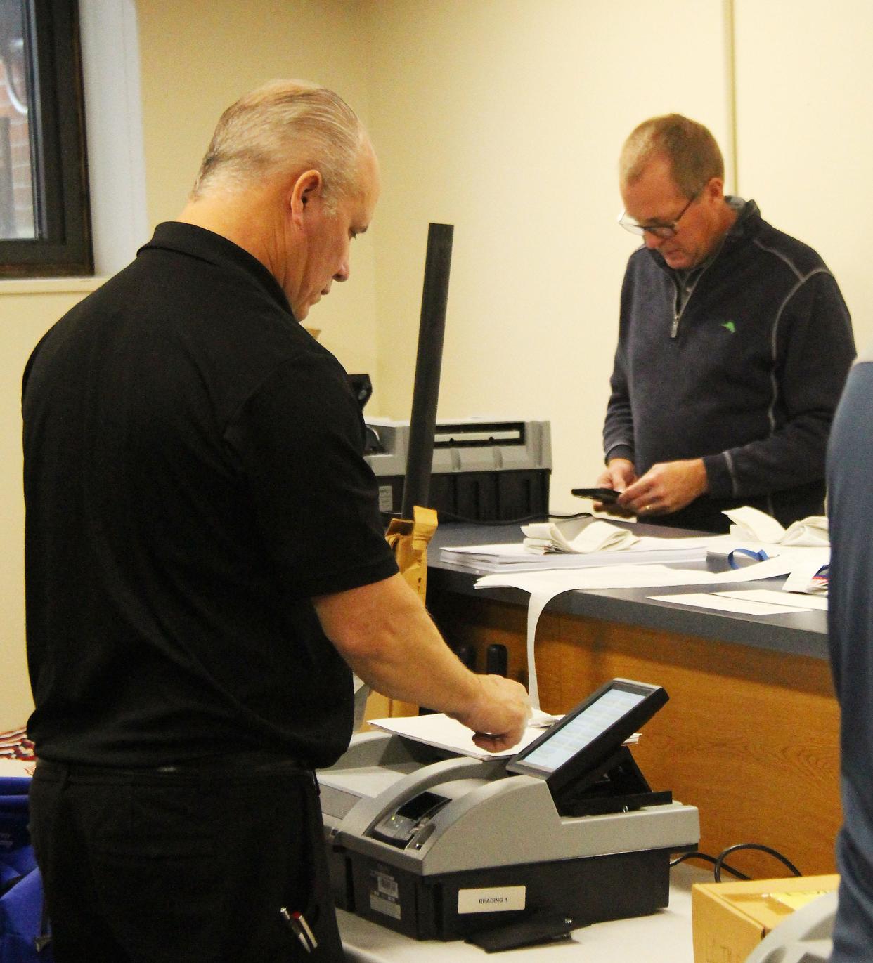 Ross Mack, left, and Ken Gibson of Liberty Systems, run checks before beginning the retabulation process from the Nov. 8 election. The retabulation took place Wednesday morning at the Livingston County Historic Courthouse.