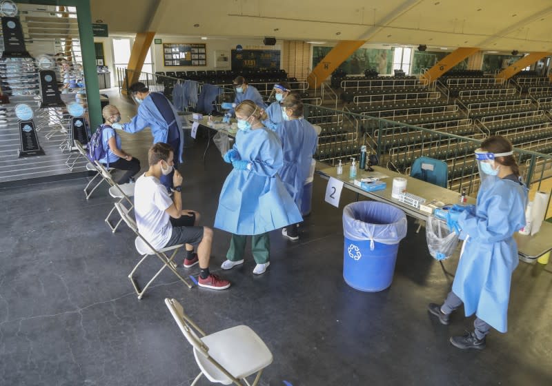 SAN DIEGO, CA - OCTOBER 15: Nursing students administer Covid tests to students in the gymnasium at Point Loma Nazarene University on Thursday, Oct. 15, 2020 in San Diego, CA. (Eduardo Contreras / The San Diego Union-Tribune)