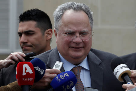 Greek Foreign Minister Nikos Kotzias talks to media after a meeting with Cypriot President Nicos Anastasiades at the presidential palace in Nicosia, Cyprus March 27, 2017. REUTERS/Yiannis Kourtoglou