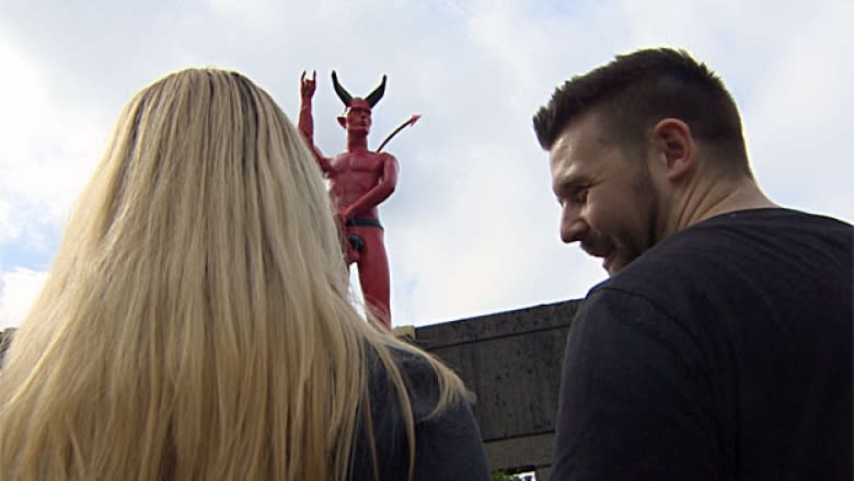 Naked devil statue erected near SkyTrain line