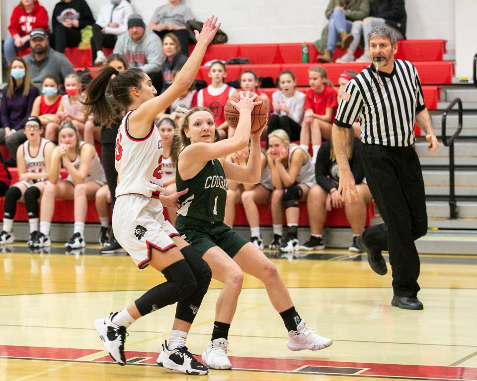 North Star's Abby Barnick goes in for a layup while being defended by Conemaugh Township's Mya Poznanski during a WestPAC girls basketball contest, Thursday, in Davidsville.