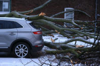 <p>An SUV slammed by fallen tree limb on Queensdale in East York during an ice storm in Toronto on April 15. (Photo from Rene Johnston/Toronto Star via Getty Images) </p>