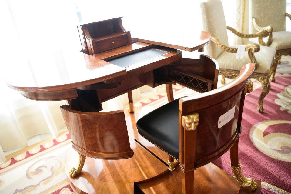 This furniture piece looks like a table before revealing itself as a desk with a pull-out chair thanks to its mechanical design. An online auction of items from Villa Collina will take place Dec. 4 before Knoxville's largest home is eventually demolished and replaced with three smaller homes.