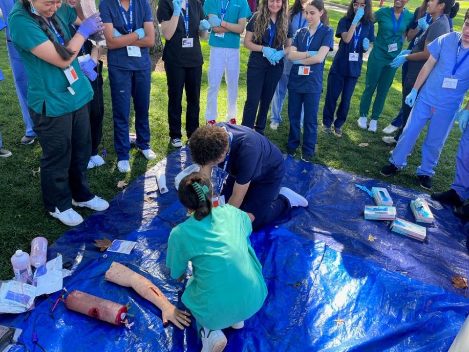 Jeffrey Radek Jr., 17, of Rochester, practices methods of stopping a patient from bleeding out while participating in the National Youth Leadership Forum: Medicine at Tufts University in Medford.