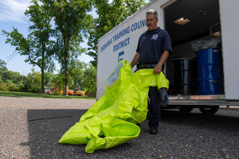 Indianapolis Fire Department Capt. Ron Troutt shows a Level A hazmat suit. Troutt heads the department hazmat response team, which has about 140 members.