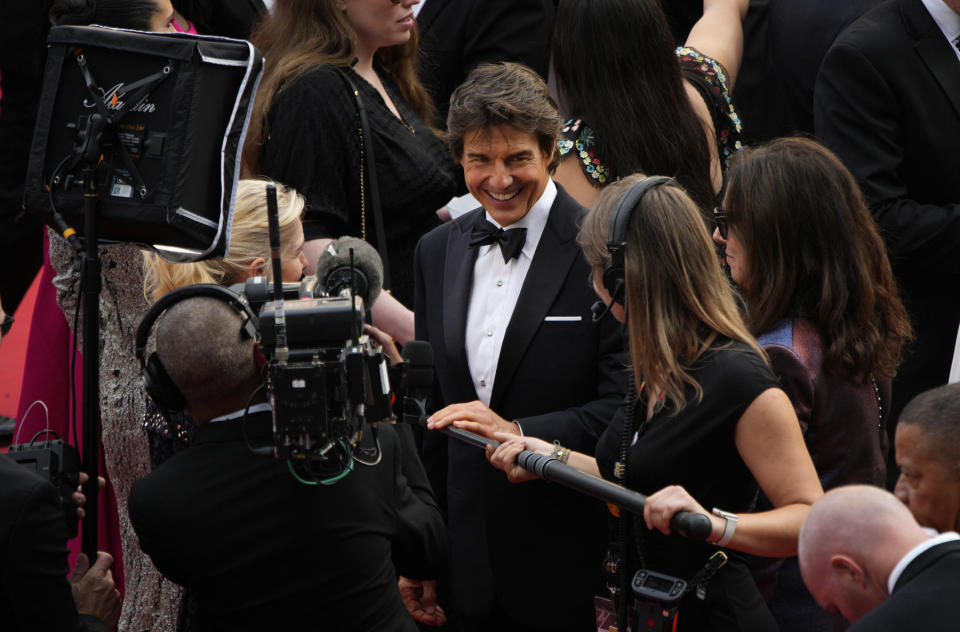 Tom Cruise arrives at the premiere of the film 'Top Gun: Maverick' at the 75th international film festival, Cannes, southern France, Wednesday, May 18, 2022. (AP Photo/Daniel Cole)