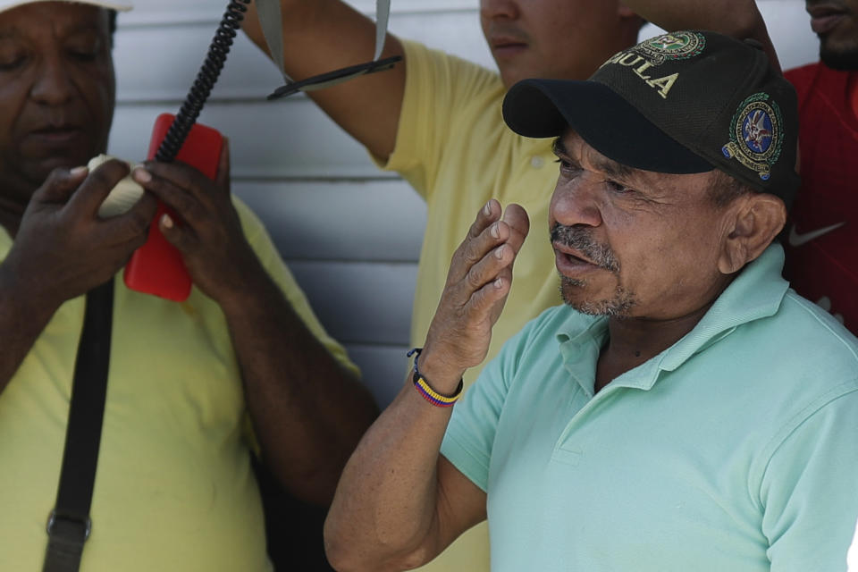 Luis Manuel Díaz talks to neighbors outside his home in Barrancas, Colombia, after he was released by kidnappers Thursday, Nov. 9, 2023. Díaz, the father of Liverpool striker Luis Díaz, was kidnapped on Oct. 28 by the guerrilla group National Liberation Army, or ELN. (AP Photo/Ivan Valencia)
