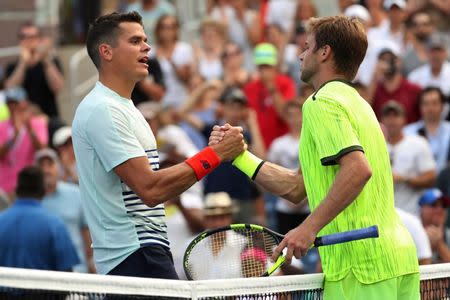 Aug 31, 2016; New York, NY, USA; Ryan Harrison of the United States (right) shakes hands with Milos Raonic of Canada (left) after their match on day three of the 2016 U.S. Open tennis tournament at USTA Billie Jean King National Tennis Center. Mandatory Credit: Geoff Burke-USA TODAY Sports