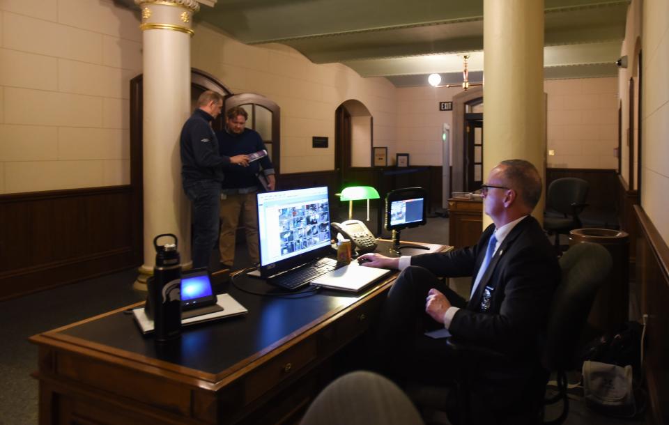 Michigan House Sergeant at Arms Jim West staffs the weapons detection monitors near the north entrance of the state Capitol, Wednesday, March 20, 2024.