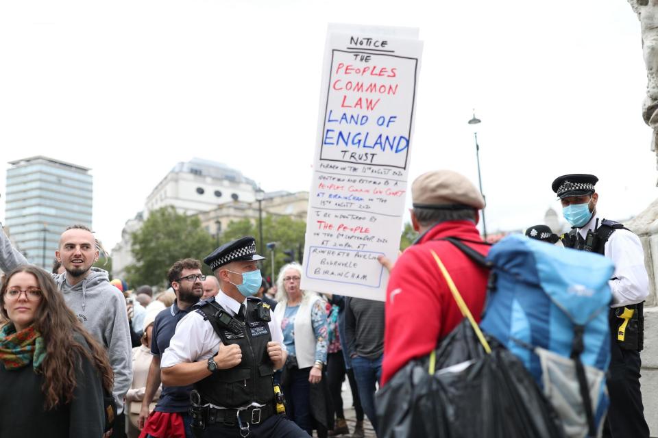 The protesters were pictured without face masks (PA)