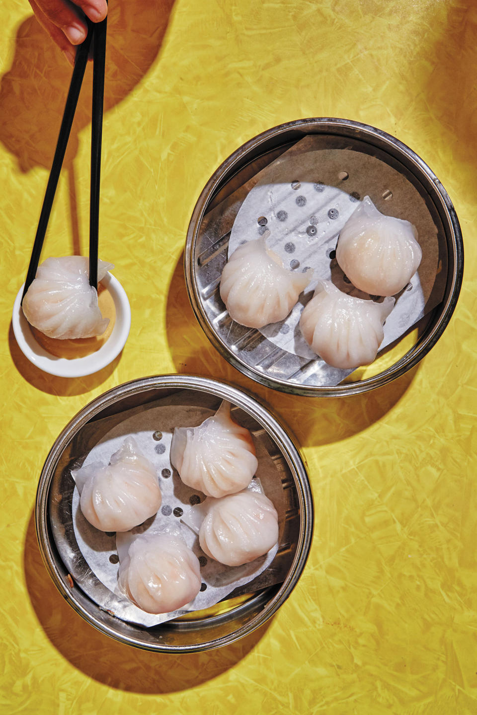 This image released by Ecco shows har gow, a recipe for shrimp dumplings, featured in “The Nom Wah Cookbook: Recipes and Stories from 100 Years at New York City's Iconic Dim Sum Restaurant," by Wilson Tang. (Alex Lau/Ecco via AP)