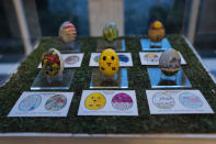 Eggs designed by children of members of the military adorn the East Colonnade of the White House ahead of the White House Easter Egg Roll, Thursday, March 28, 2024, in Washington. (AP Photo/Evan Vucci)