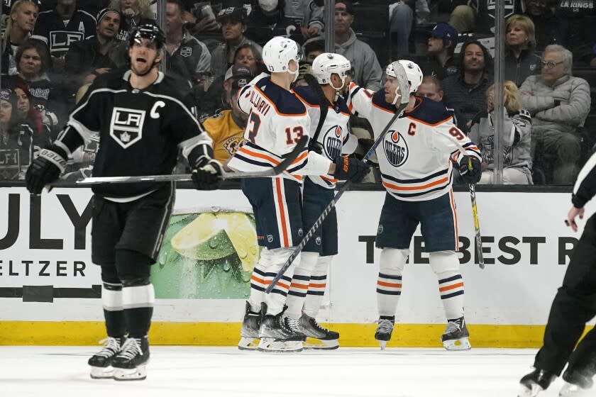 Edmonton Oilers left wing Evander Kane, second from right, celebrates his goal with center Connor McDavid.