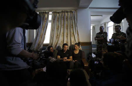 Israelis trekkers Maya Ora (R) along with Yakov Megreli (C) and Linor Kajan (L), who were rescued from an avalanche by the Nepalese army, speak to the media at the Army Hospital where they are undergoing treatment in Kathmandu October 16, 2014. REUTERS/Navesh Chitrakar