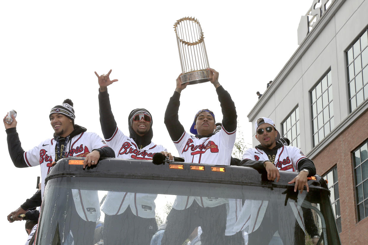 ATLANTA, GA - NOVEMBER 05: Cristian Pache of the Braves hold up the Commissioners trophy during the World Series Championship Parade and Celebration at The Battery and Truist Park on November 5, 2021 in Atlanta, Georgia.   (Photo by David J. Griffin/Icon Sportswire via Getty Images)